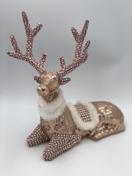 pink sequin reindeer sitting